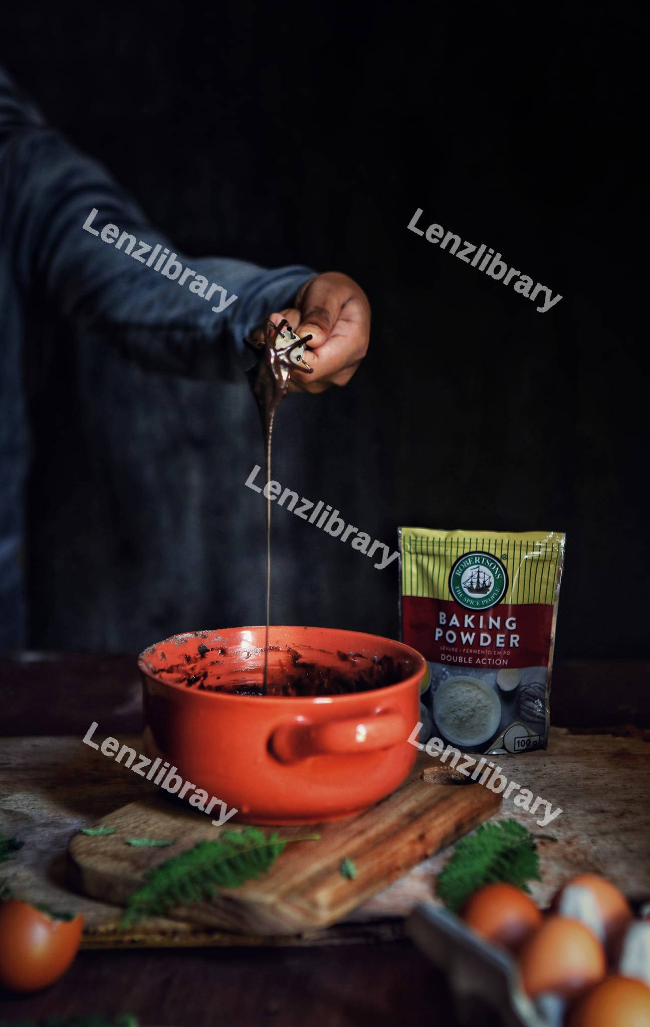 A person stirring a cocoa powder
